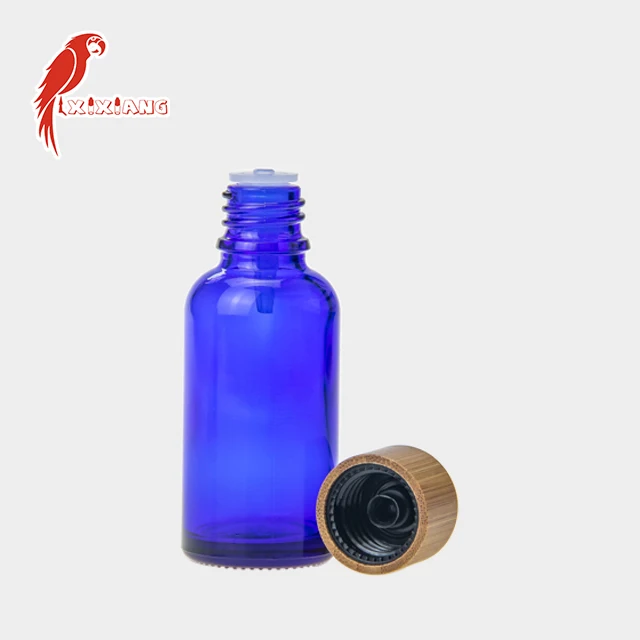 
30ml CBD Blue Glass Bottle with wooden color Childproof Tamper Cap 