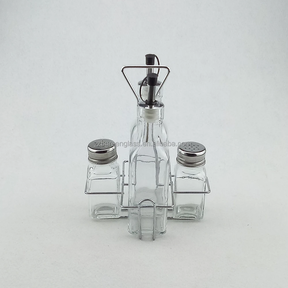 Clear glass salt pepper shakers and oil vinegar bottles