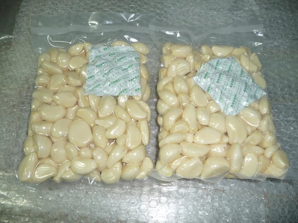 Свежие очищенные чесночные гвоздики оптом