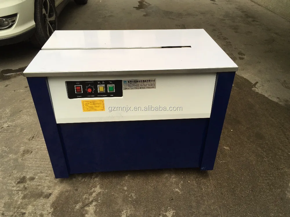 Guangzhou MingNa transpak pp packing slipper banknote carton pp strap pressure type plasticpet strap machine