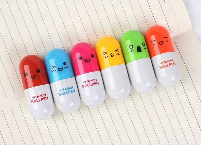 Lovely creative stationery smiling face plastic wholesale novelty pill ballpoint cute pen for gift