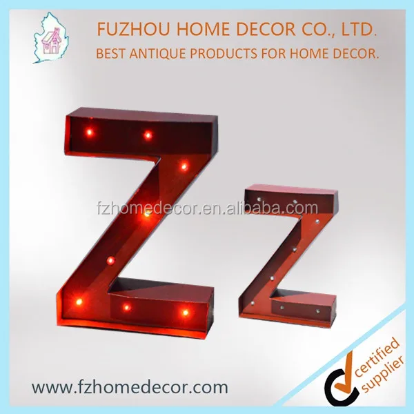 Decorative standing metal letters with lighted H letter