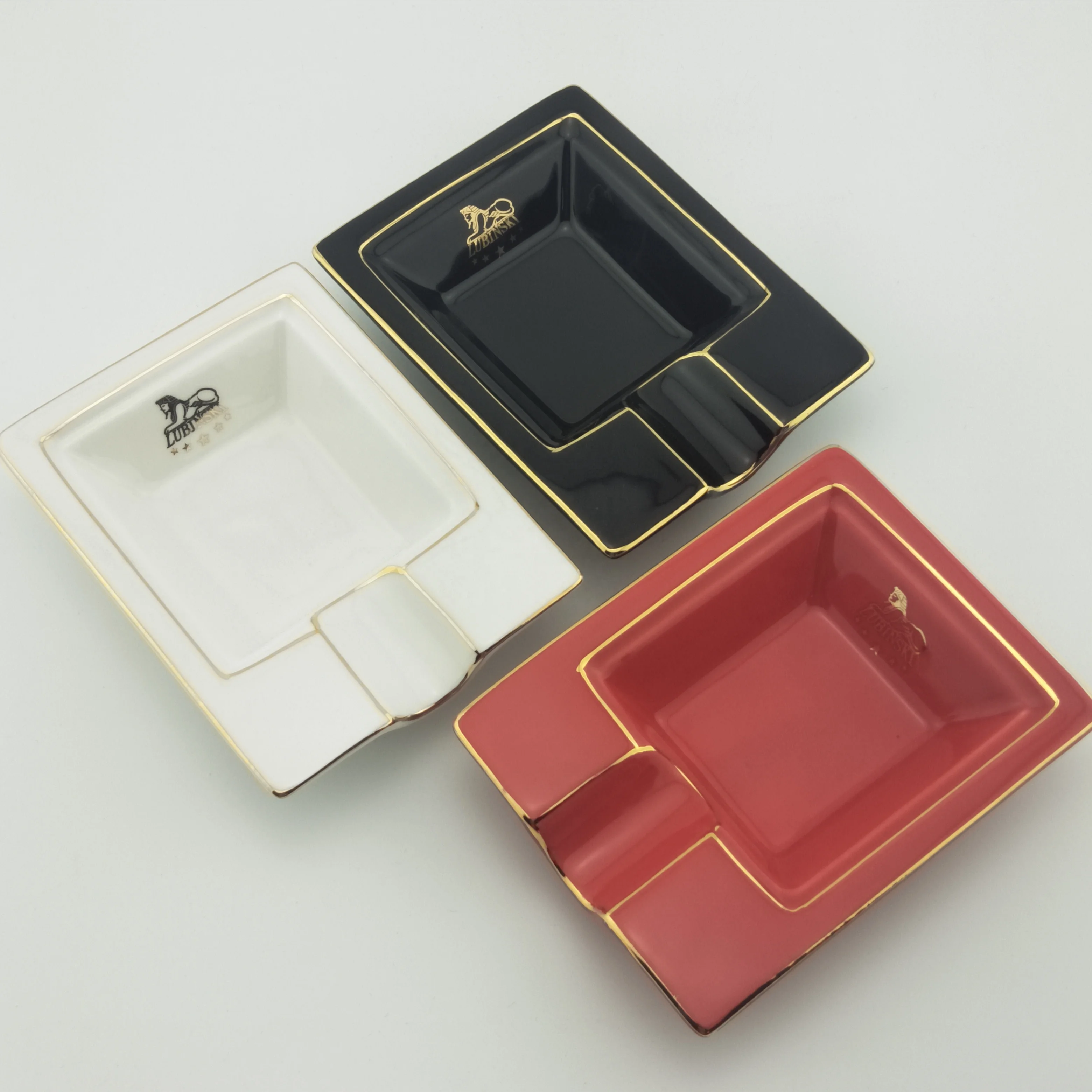 
Best selling black ceramic ashtray with golden edge with one rest with customized logo for sale 