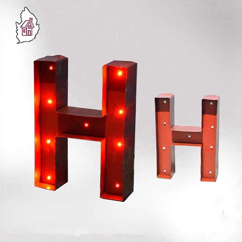 Decorative standing metal letters with lighted H letter