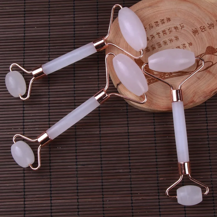 The rose quartz massage roller is used jade roller for face facial