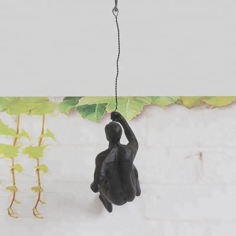 Rock climb with rope Muscular man bronze sculpture