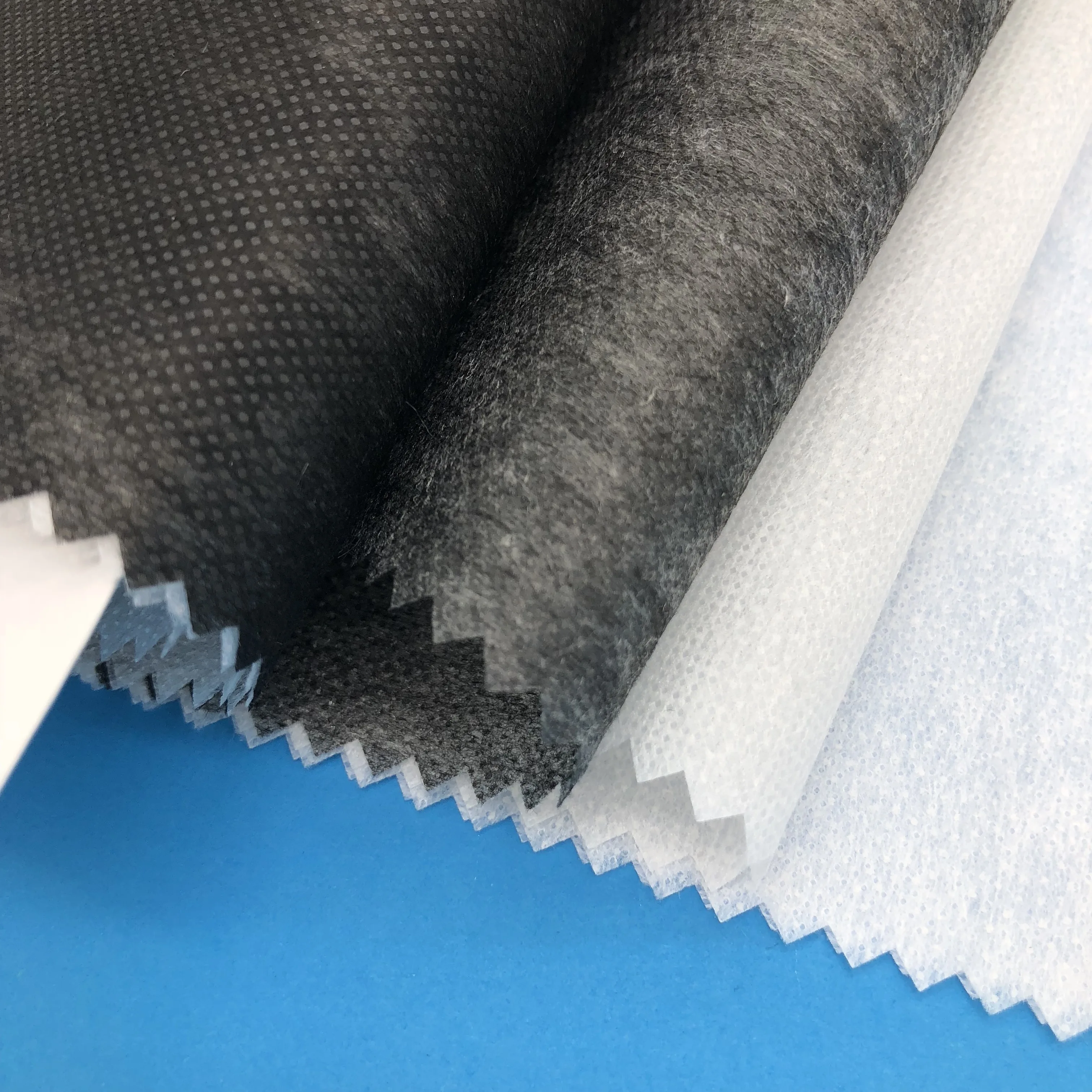 
100 polyester nonwoven fusible hot rolling interlining for apparel 