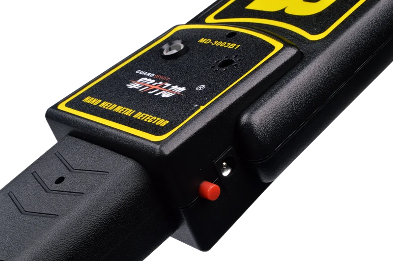 
security guard hand holding mini metal detector for public safety checking 