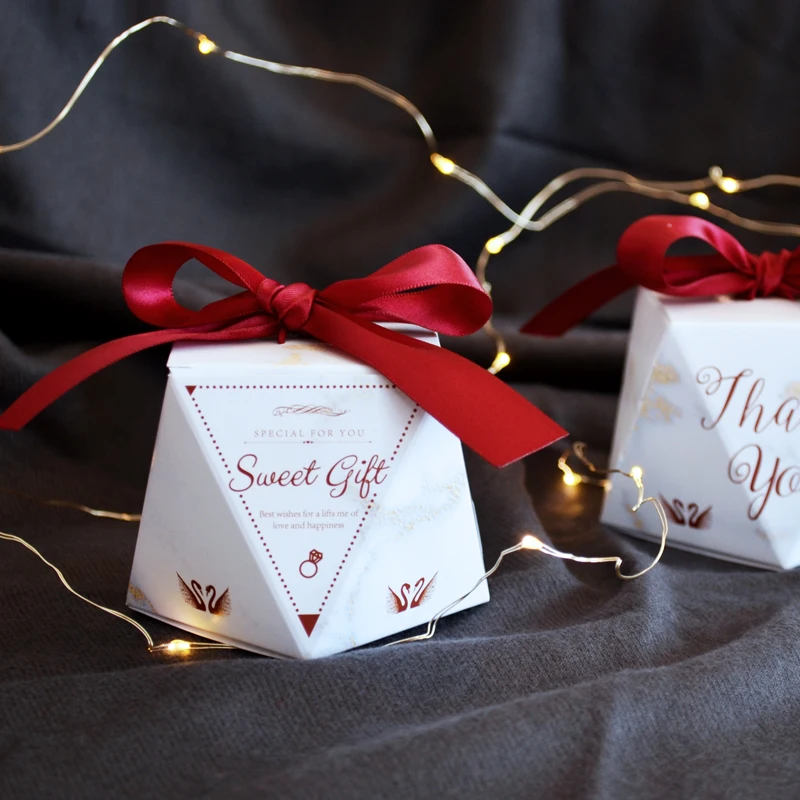 
Retail white diamond style folding candy boxes with red ribbon 