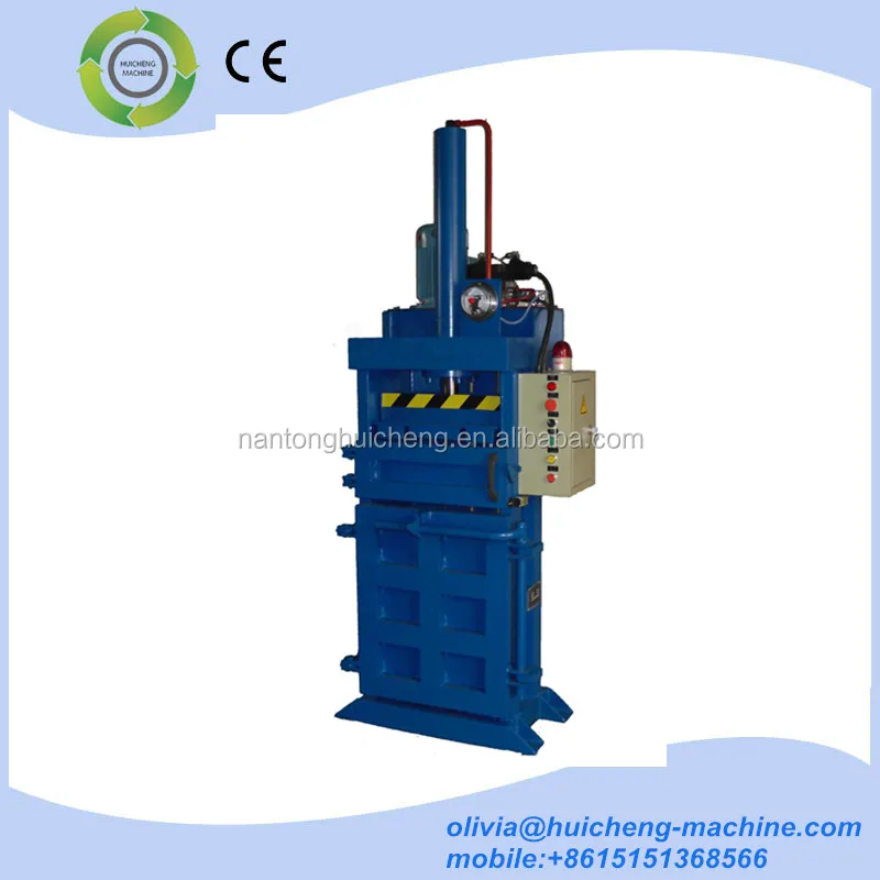 Plastic scrap, paper, cotton and woodchips compress baler machine