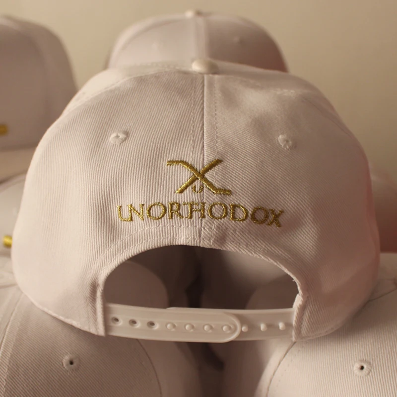 Acrylic leather brim snapback cap with gold metallic thread embroidery