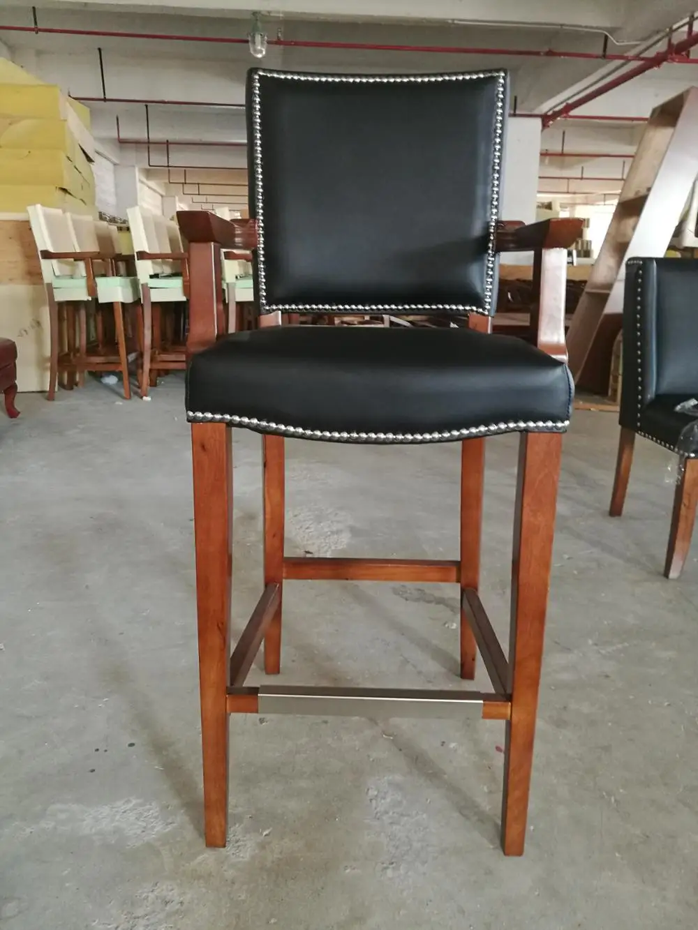 Durable black leather bar stool with armrest