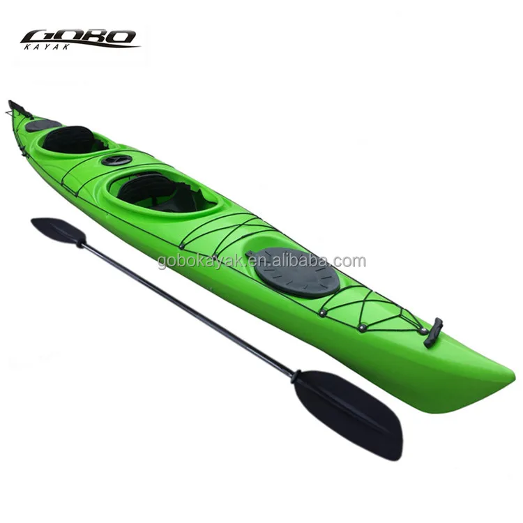 Double sit in sea kayak with pedals and paddles