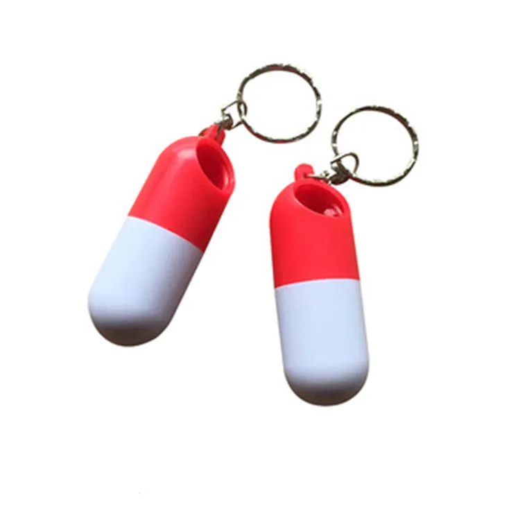 portable capsule shaped pill box with keychain