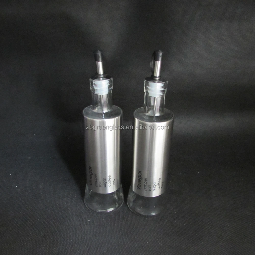 Glass salt pepper shakers and oil vinegar bottles with metal stand