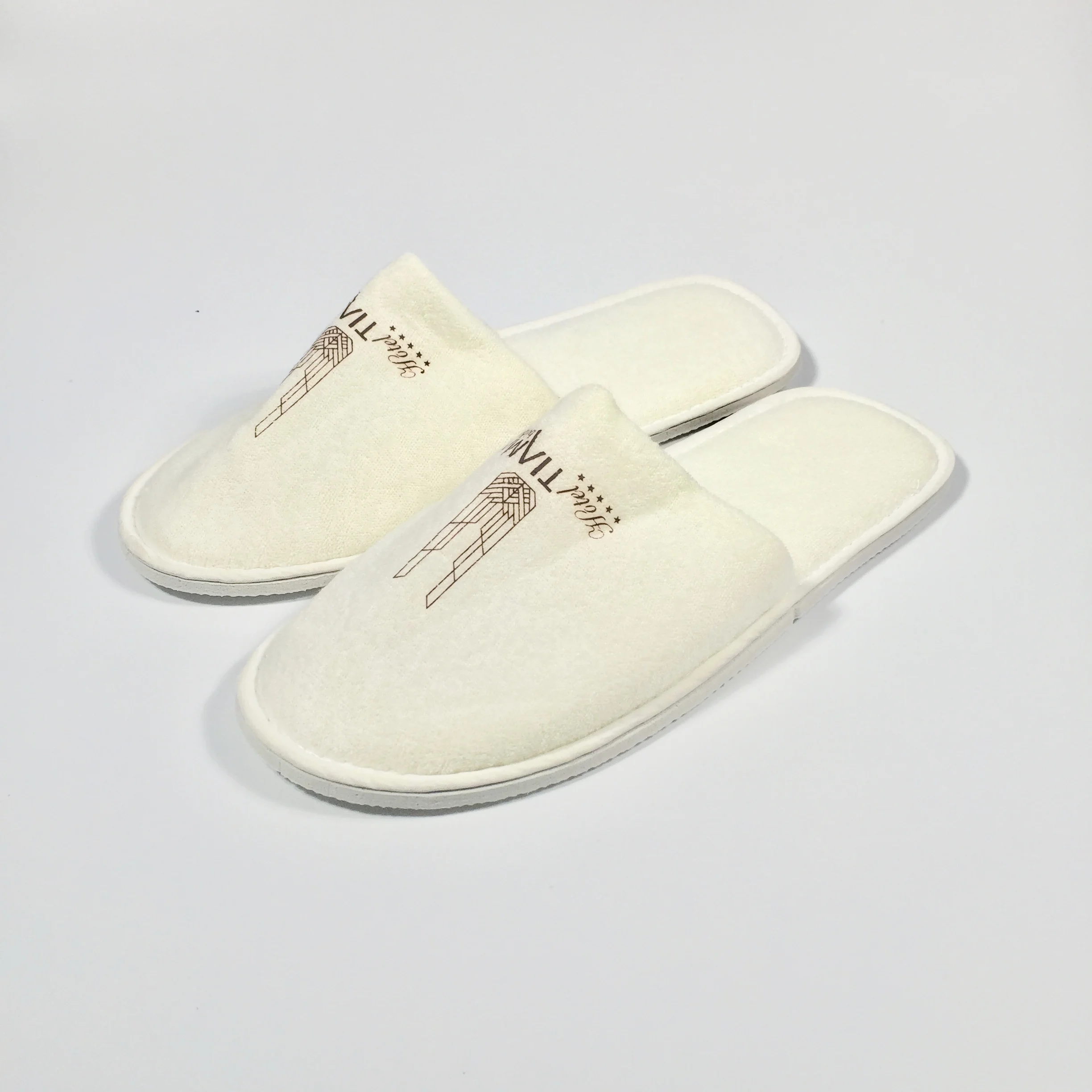 
Promotional White Towel Hotel Slipper Hotel Spa EVA PVC Bath Sippers Cheap High Quality Disposable Recycle Hotel Slippers 