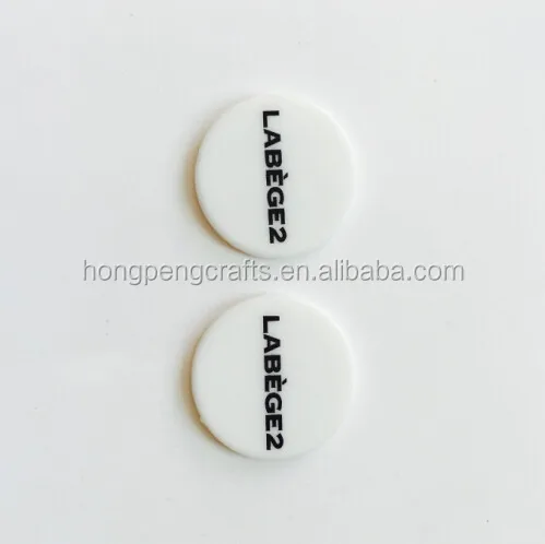 
Colored embossed plastic token/coin 