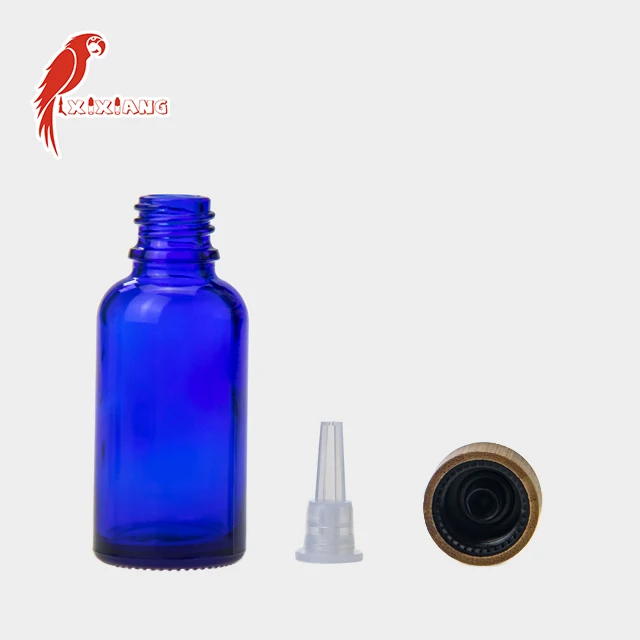 
30ml CBD Blue Glass Bottle with wooden color Childproof Tamper Cap 