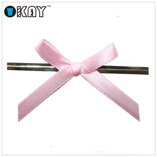 Розовые маленькие ленточные банты с проволочным твист-галстуком для упаковки мешков для конфет