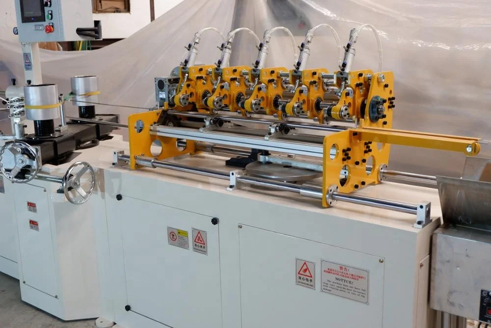 Automatic straw paper suction tube rewinding cutting machine