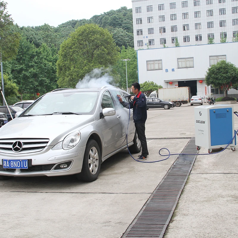 Car mat cleaning mechanic simply operates steam cleaning car washing equipment