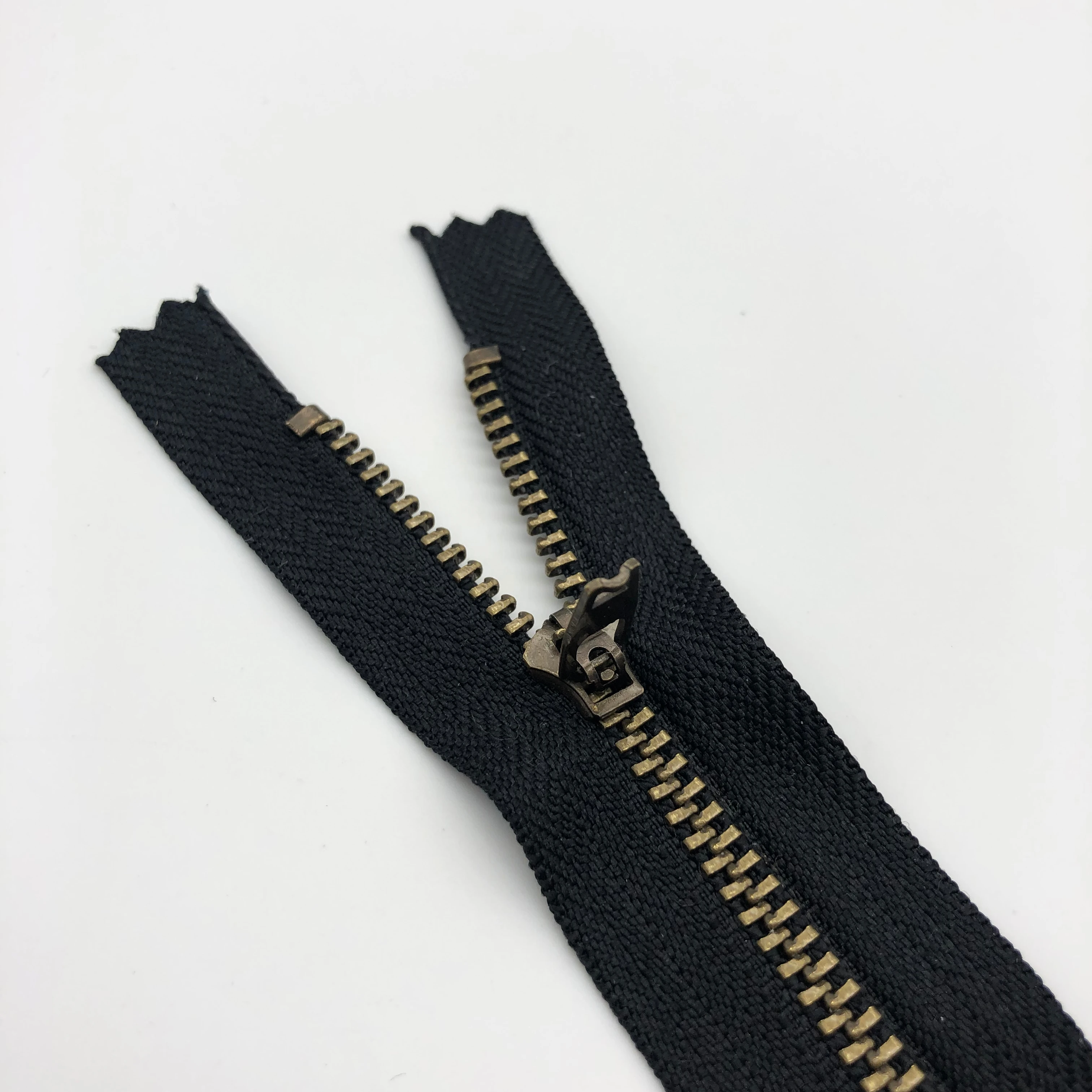 cheap brass metal yg zipper 15cm for jean pant