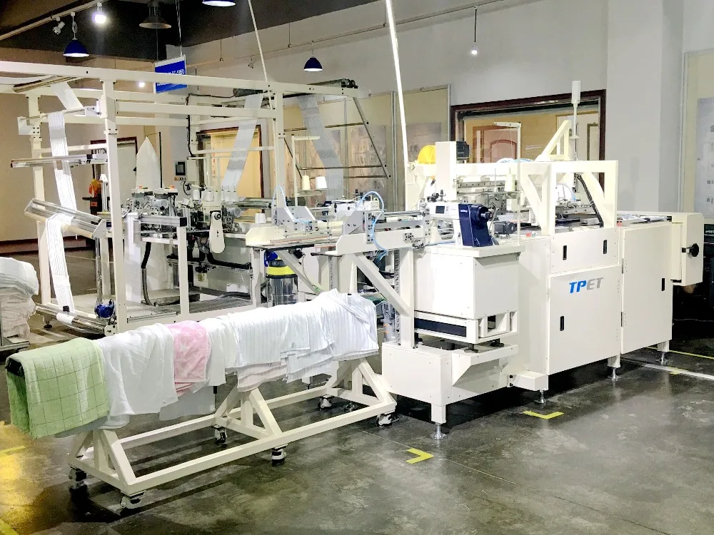 AUTOMATIC TERRY TOWEL CROSS HEMMING MACHINE