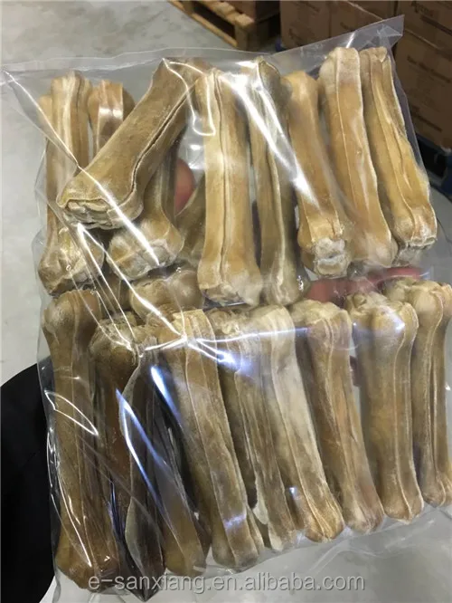 big dog chewing food rawhide pressed bones