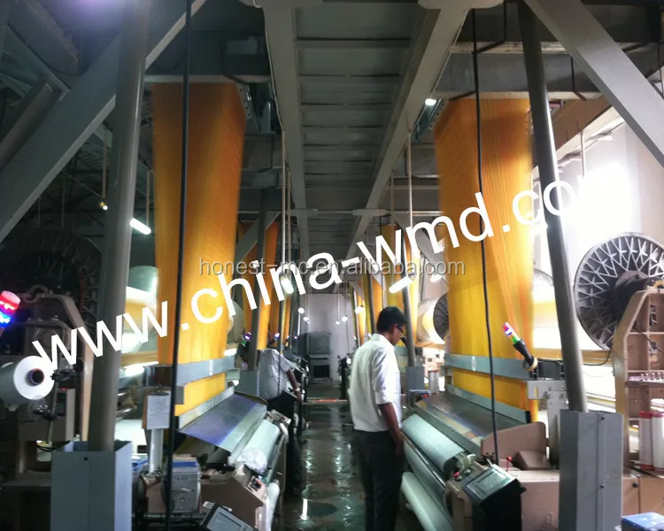 Electronic jacquard water jet loom weaving polyester fabric with high speed