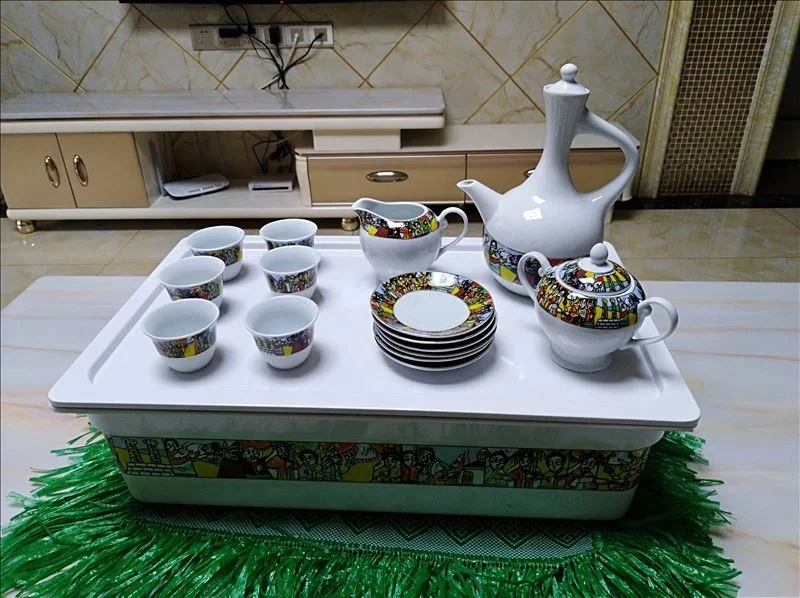 Coffee tray of rekebot for Ethiopian Eritrean Coffee ceremony with saba and tilet designs