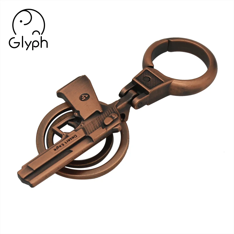 Wholesale 3d bronze fancy gun shaped keychain handmade craft keyring for promotional gift