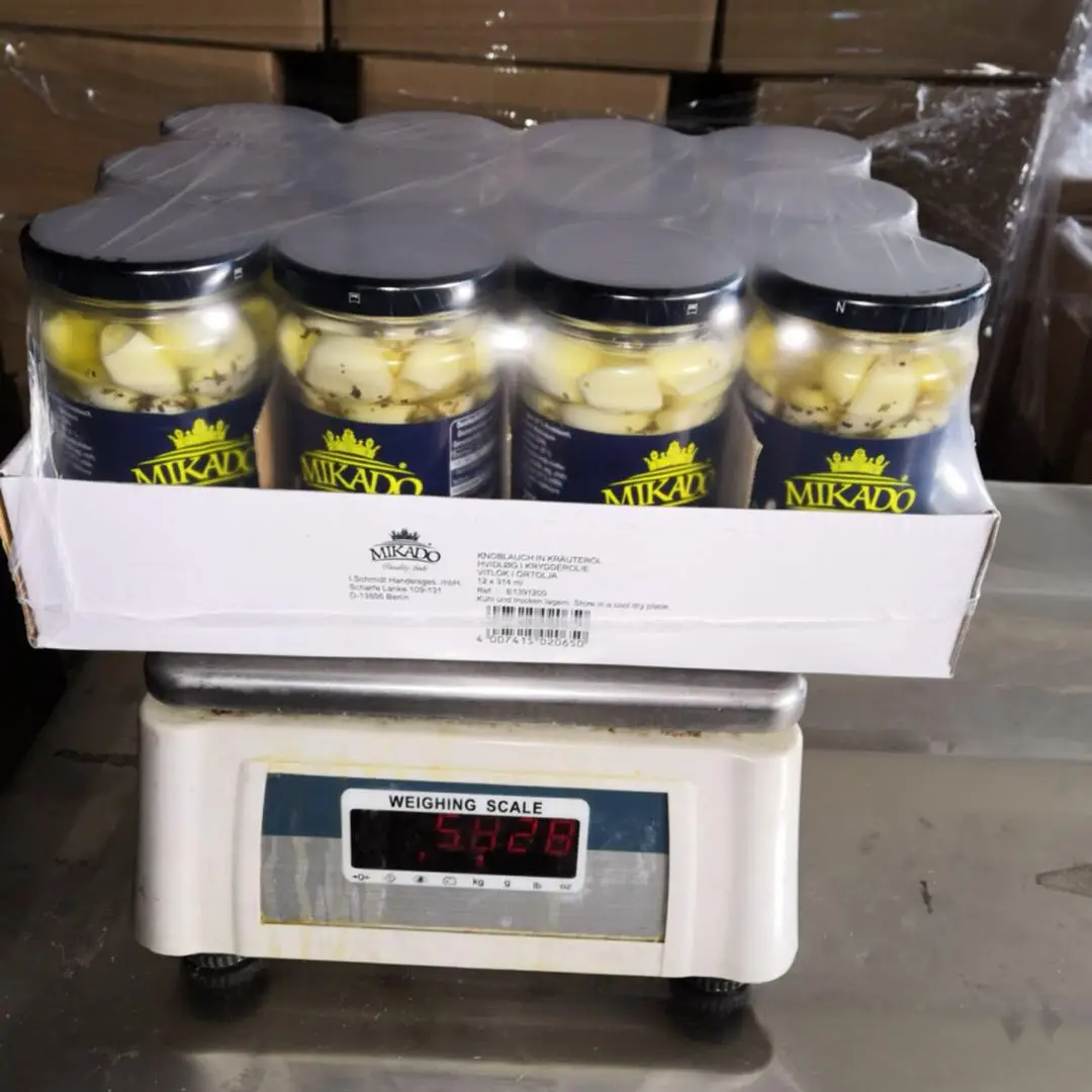 Chinese canned garlic clove with herbs in sunflower seed oil for sal