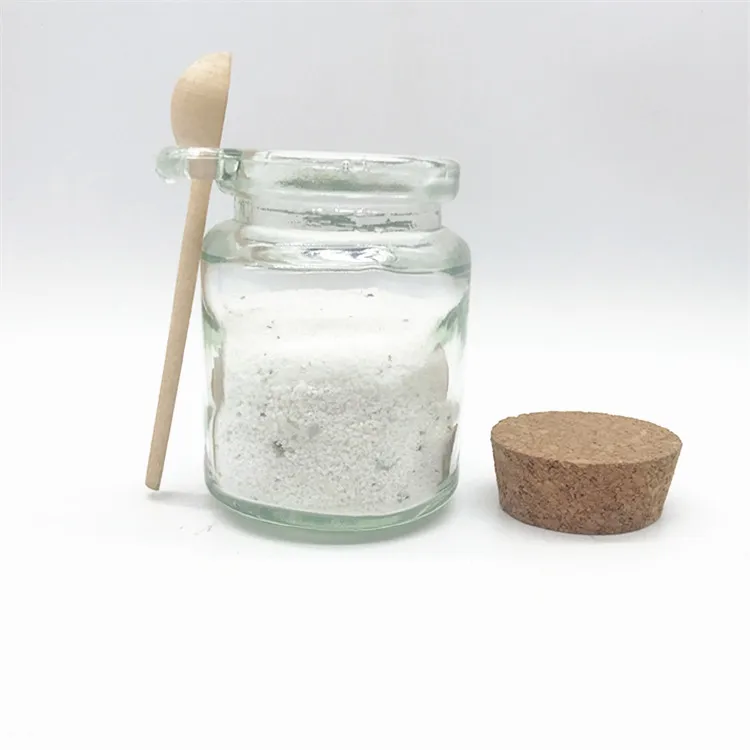 glass jar with wooden spoon   glass essential oil bottle