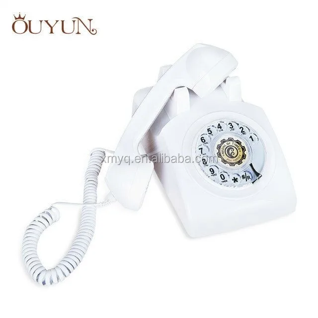 Классический офисный телефон с вращающимся циферблатом на