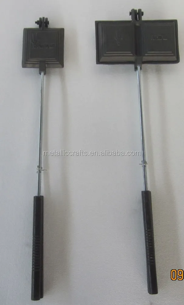 
heavy cast iron fireside pie iron with stay-cool wooden handles 