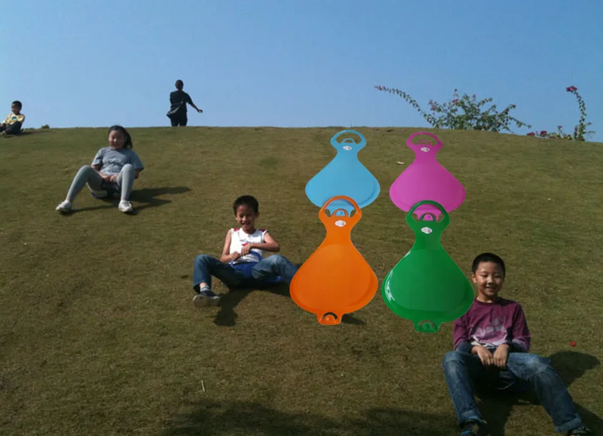 connected plastic kids adults snow slide board on grass and sand one by one