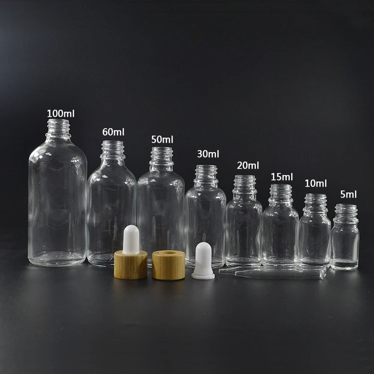 Empty essential oil perfume container round 30ml clear glass dropper bottle with bamboo lid
