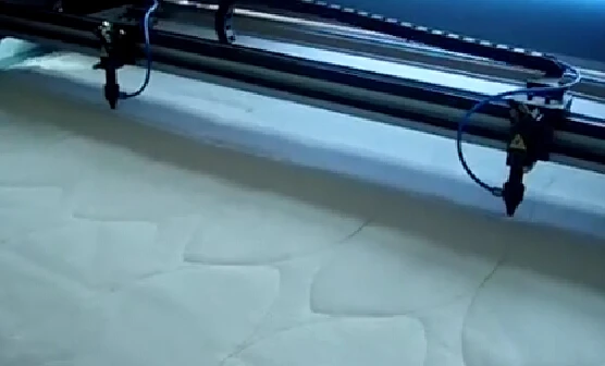 
1800*1000 Fabric Laser Cutting Machine Double Laser Heads Laser Cutting Machine for Toy/Hats/Football/Bag Cutting 