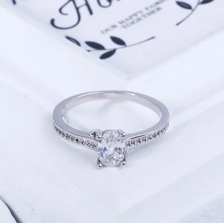 Copper Jewelry Oval Four Claws Simulated Diamond Drill Bit Engagement Crown Plated White Gold Ring