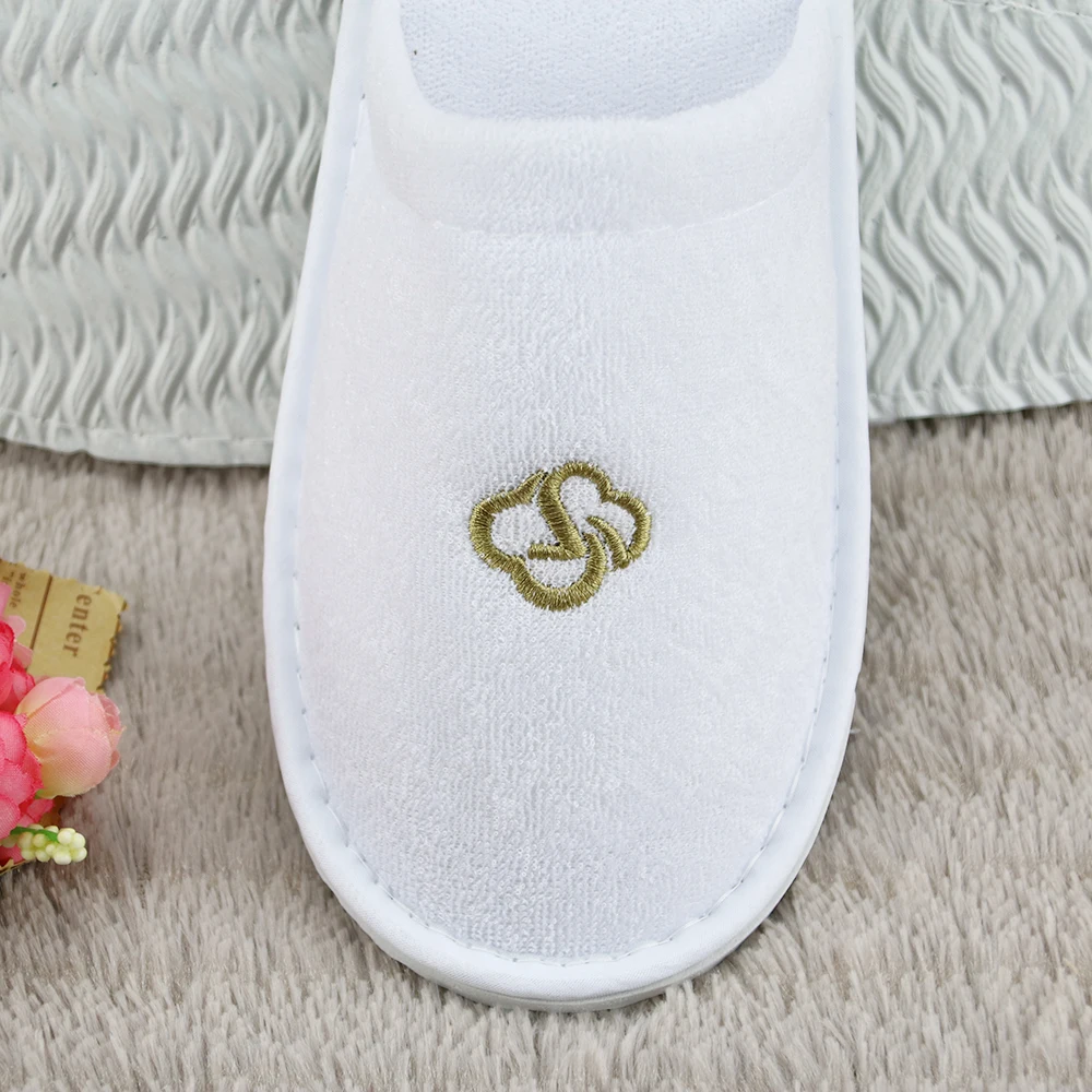 
white terry disposable hotel bathroom slippers 