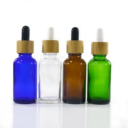 Empty essential oil perfume container round 30ml clear glass dropper bottle with bamboo lid