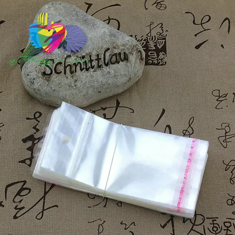 Yiwu cheap transparent header opp plastic bag with card for things