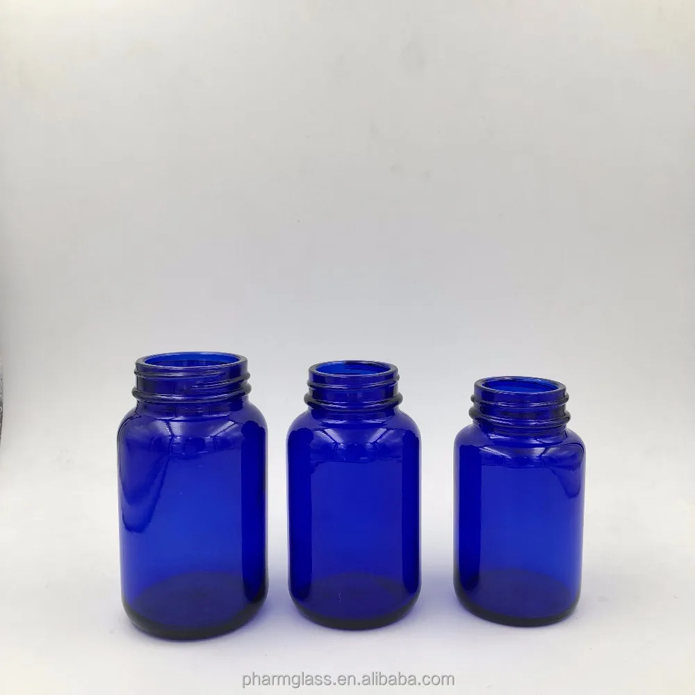 Кобальтовые синие и зеленые стеклянные бутылки с широким горлом