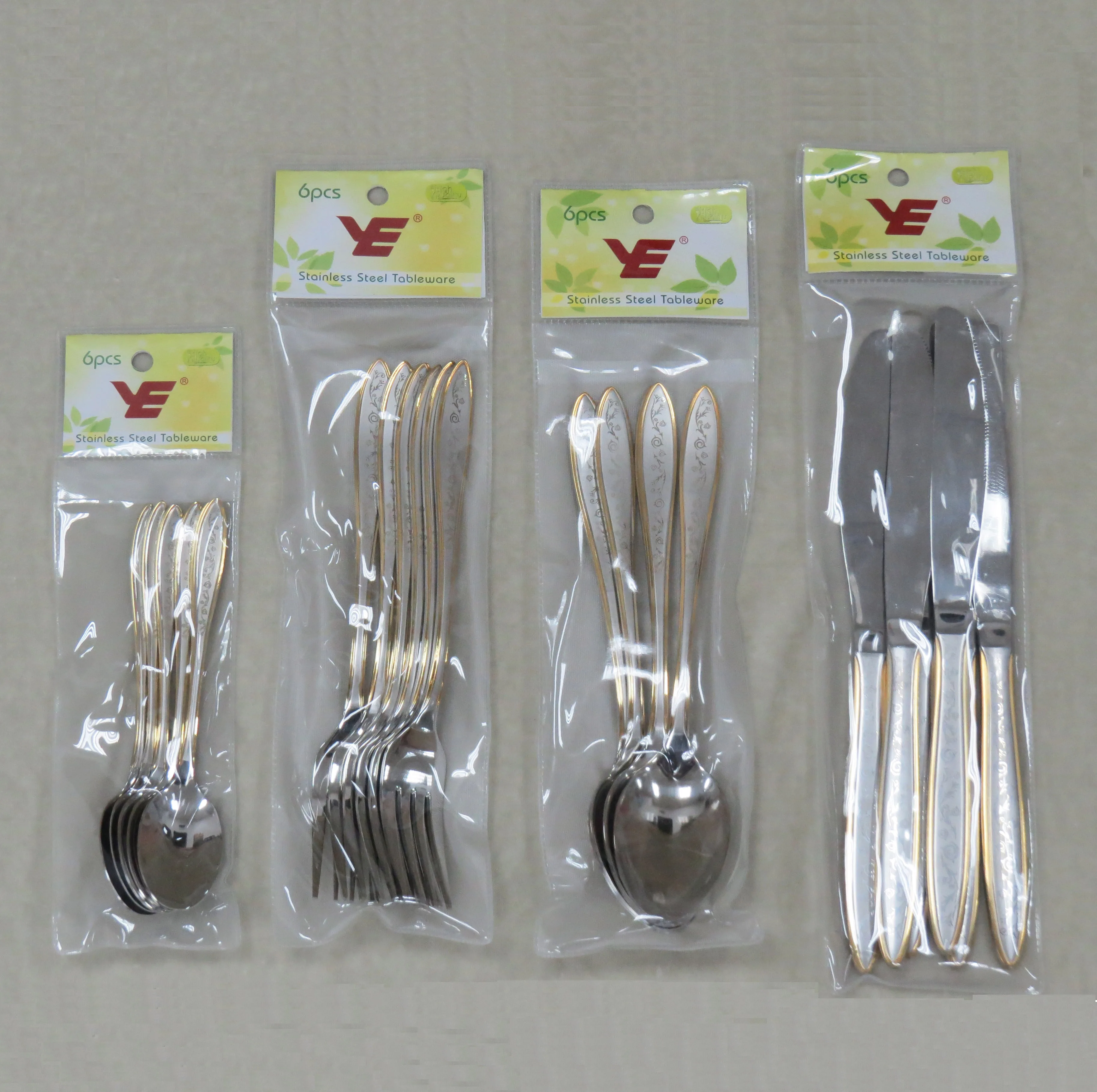 6pcs stainless steel cutlery set with Gold and Laser pattern in plastic bag with tie card for supermarket