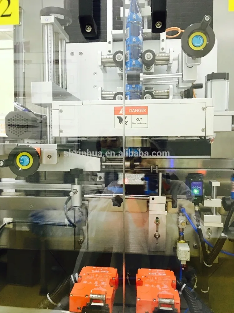 XINHUA Automatic Bottle Shrink Sleeve Labeling Machine Sleeve Label Applicator