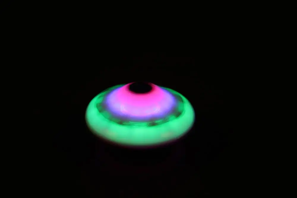 LED Flashing light and music plastic football mini spinning top toy