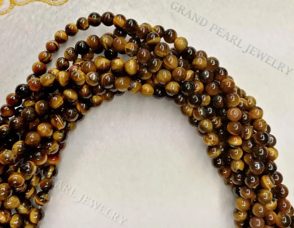 
Yellow / Brown Tigereye round beads in 16
