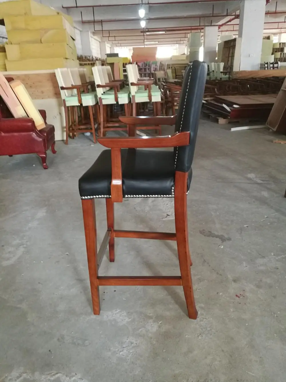 Durable black leather bar stool with armrest