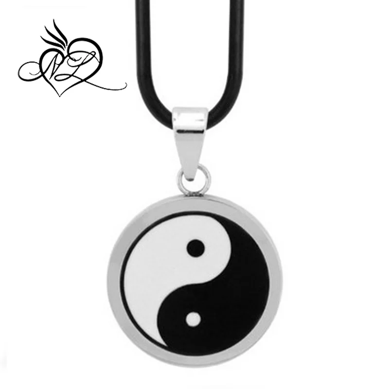 A yin-yang ancient symbol the black and white ceramic is inlaid in stainless steel frame