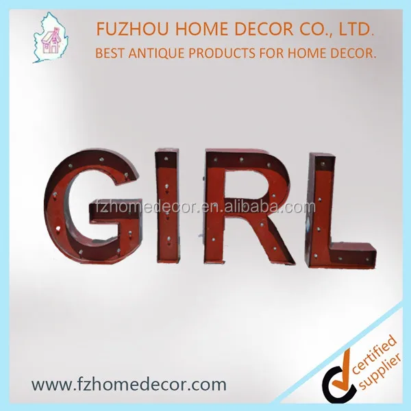 Decorative standing metal letters with lighted H letter